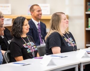 two teachers smiling at camera
