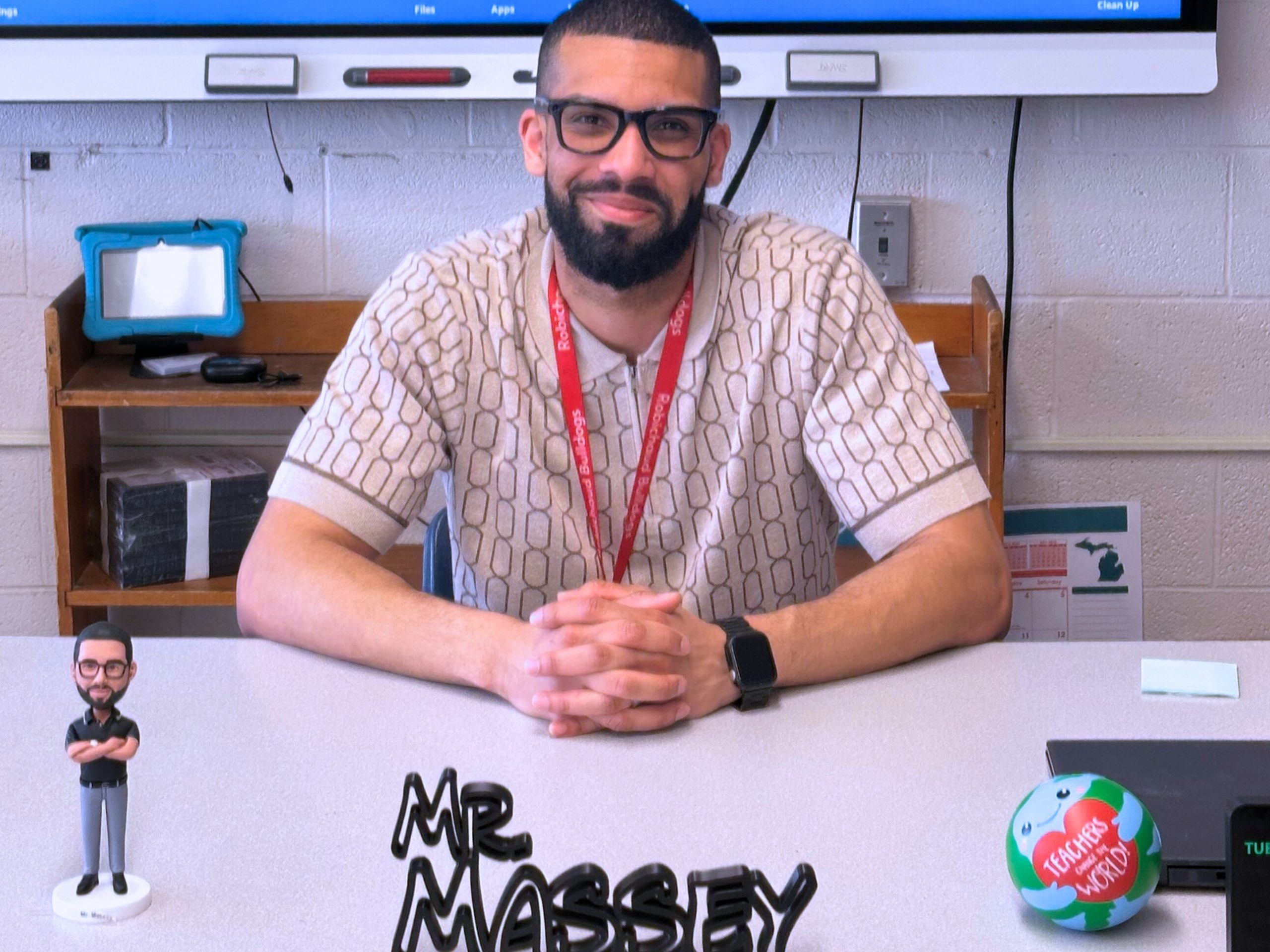 Teacher Mr. Massey at his desk