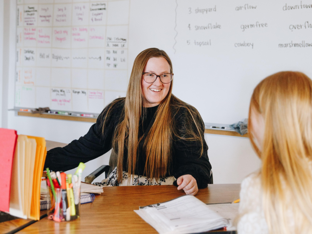 Teacher smiling at a student