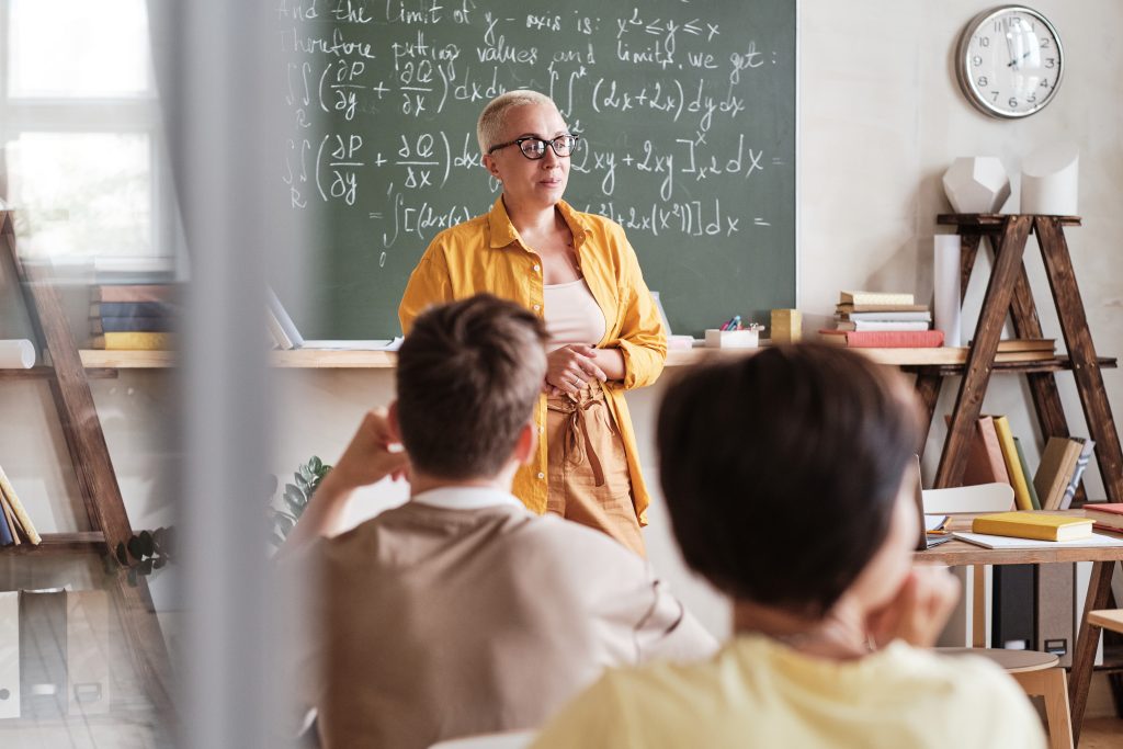 Teacher in a classroom teaching her students