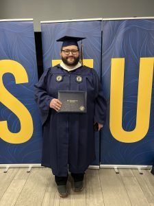 John Fitzsimons in cap and gown