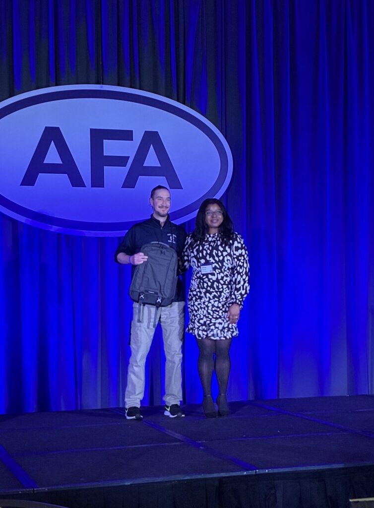 Aaron Pfau Receiving Award