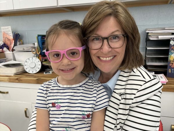 Lisbeth and student smiling in classroom